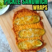 Low carb viral pickle sandwich wrap on a cutting board next to lettuce, turkey slices and a sauce.