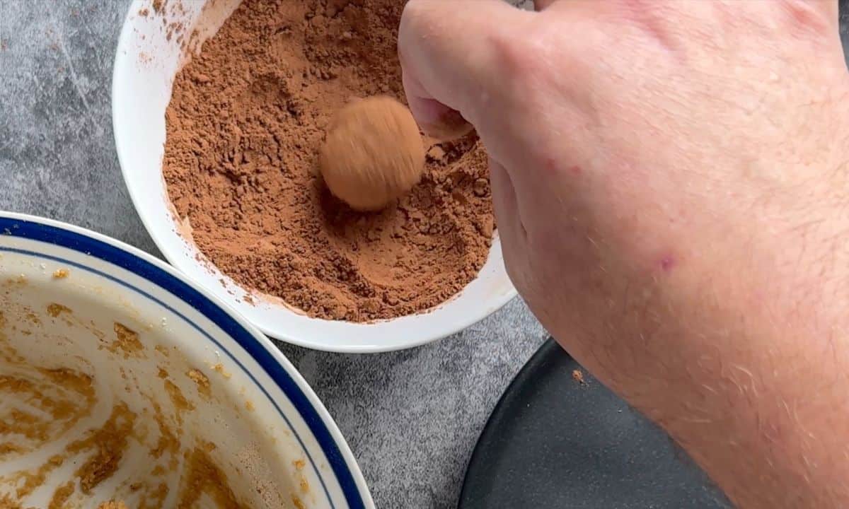 Rolling the tiramisu ball in cocoa powder.