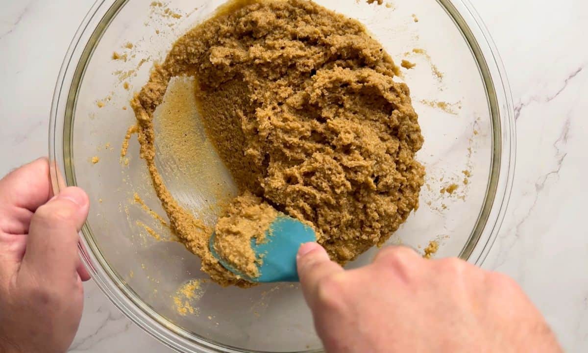 Mixing the combined wet and dry ingredients for the low carb gingerbread muffins.