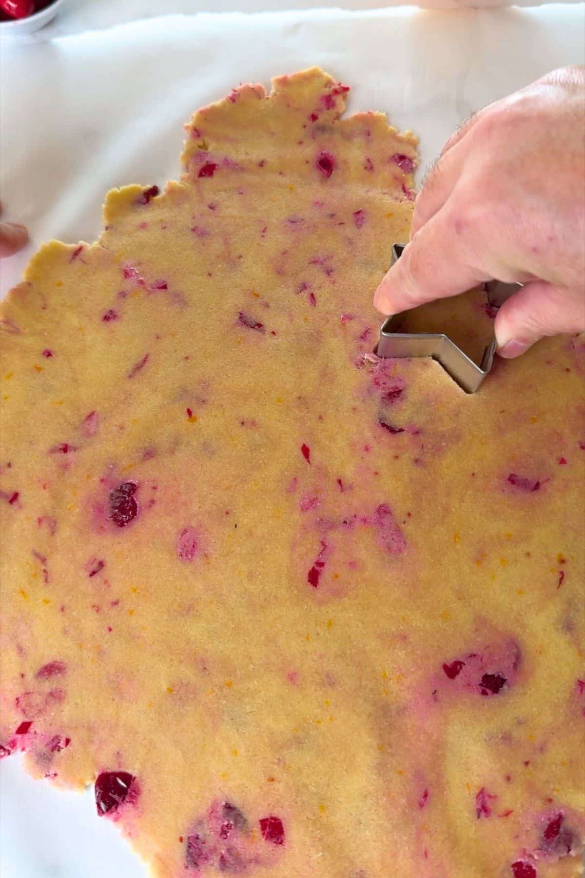 Cutting out the cookie stars.