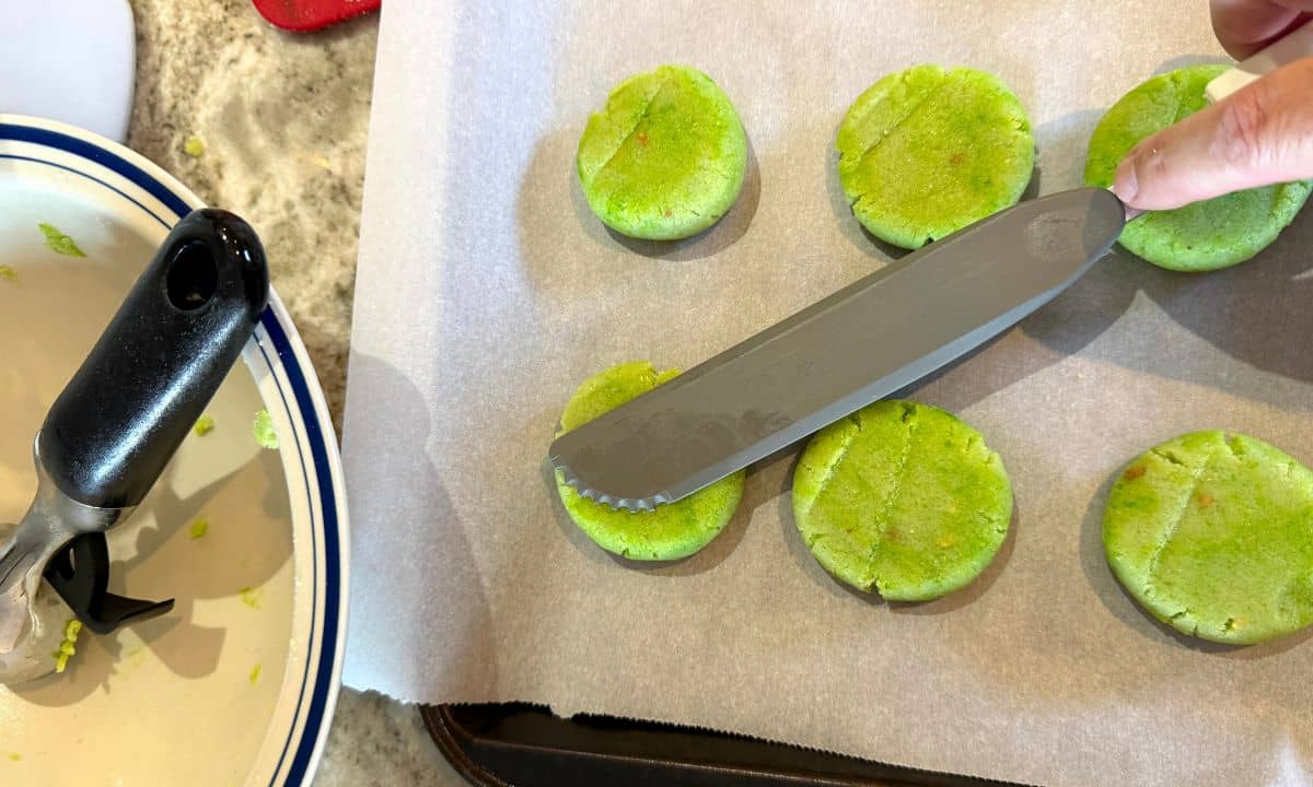 Flattening the dough balls.