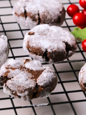 Close up of low carb chocolate crinkle cookies on a cooling rack.