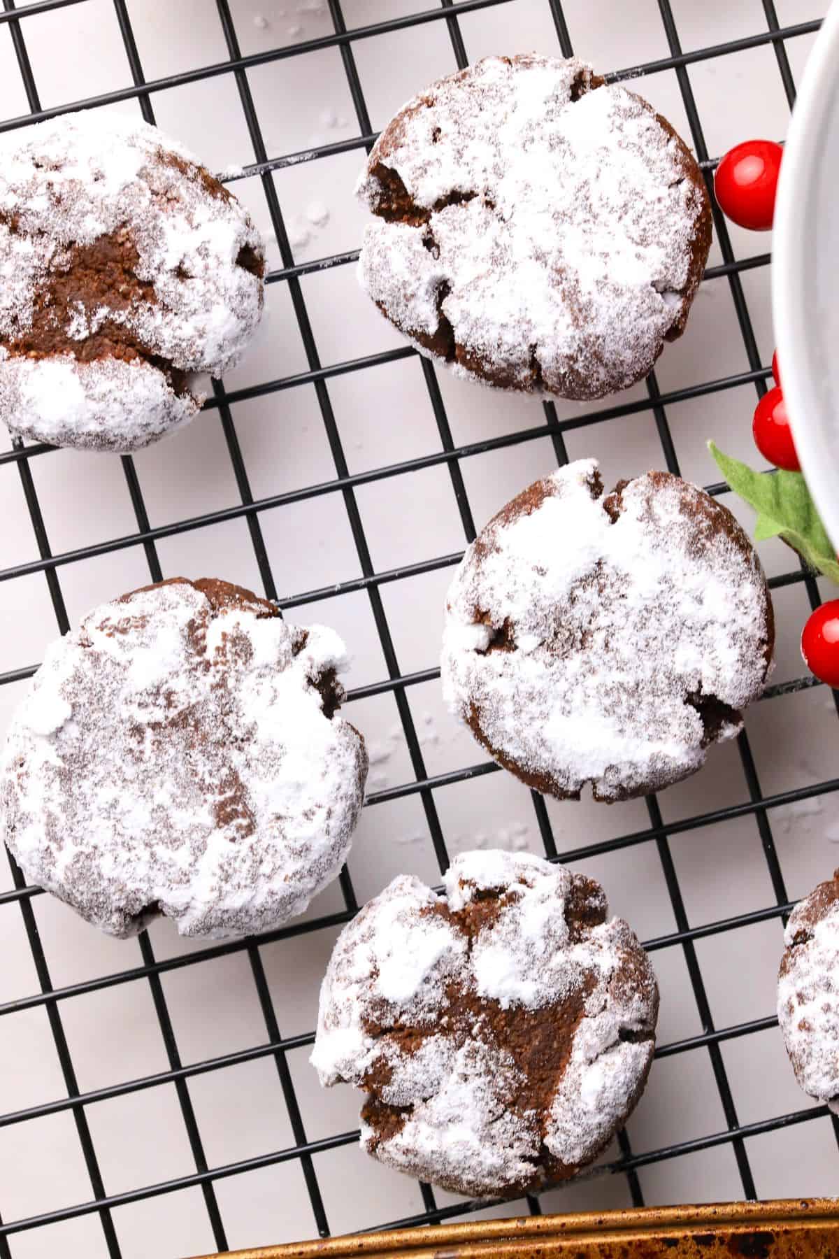 Close up of low carb chocolate crinkle cookies on a cooling rack.