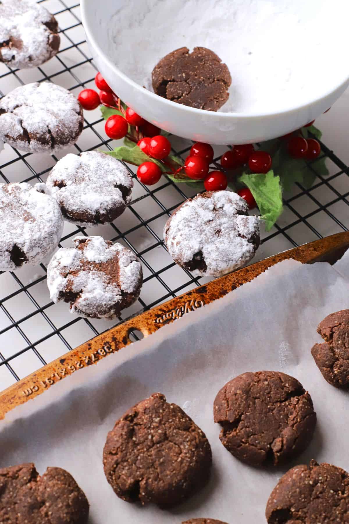 Close up of low carb chocolate crinkle cookies on a cooling rack.