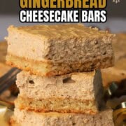 Low carb gingerbread cheesecake squares stacked on top of each other.