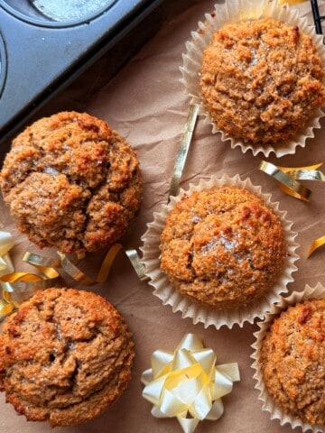 Low carb gingerbread muffins on parchment paper with a bow.