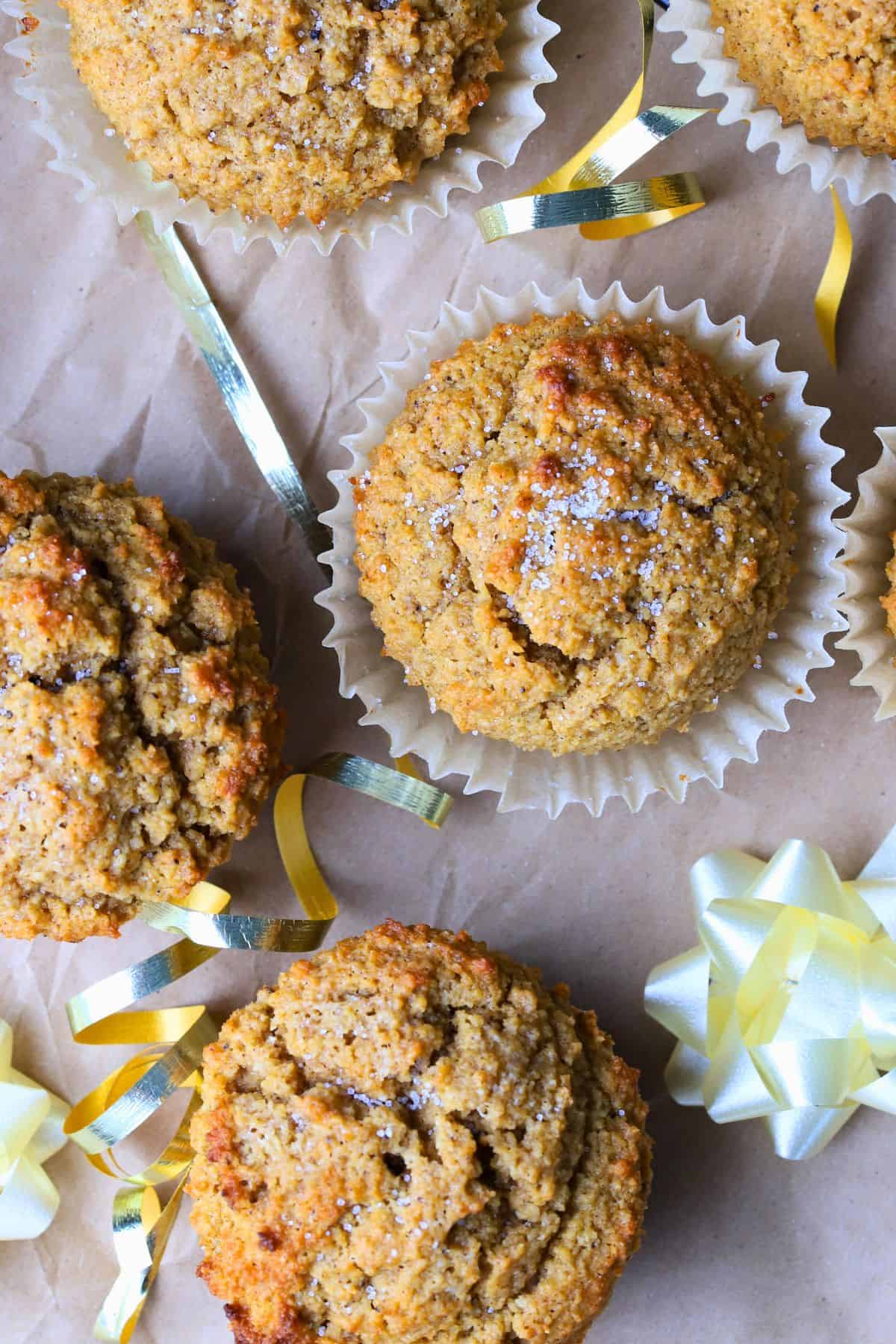 Low carb gingerbread muffins on parchment paper with a bow.