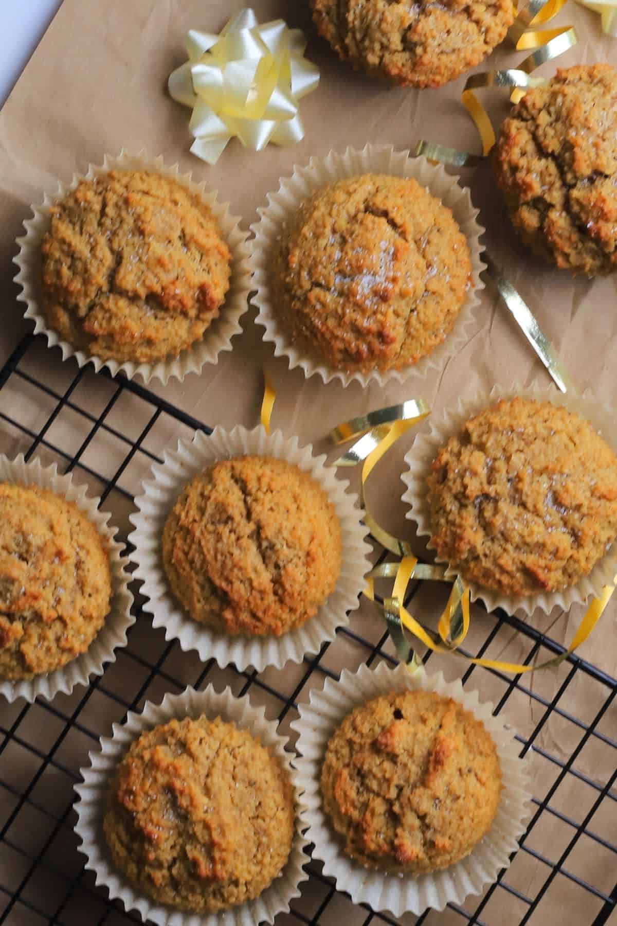 Low carb gingerbread muffins on parchment paper with a bow.