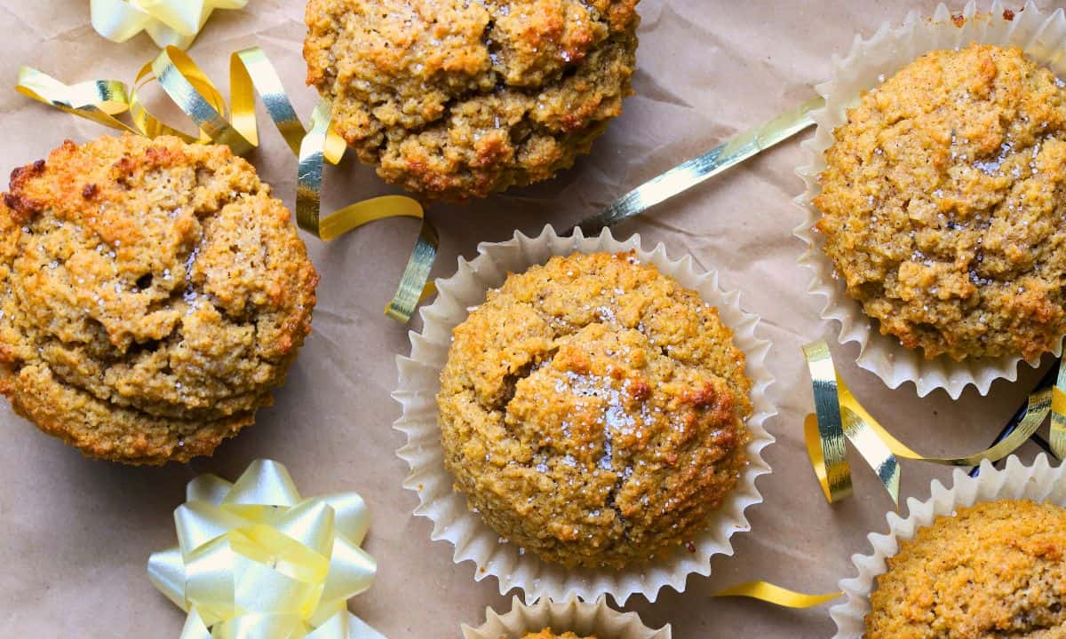 Low carb gingerbread muffins on parchment paper with a bow.