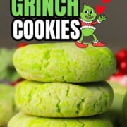 Low carb grinch cookies stacked on a cooling rack.