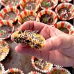 Holding a half of a low carb holiday pecan toffee bite in my hand.