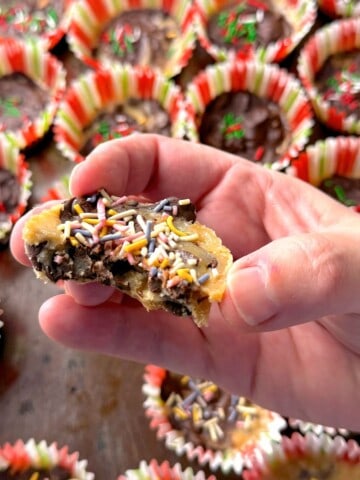 Holding a half of a low carb holiday pecan toffee bite in my hand.