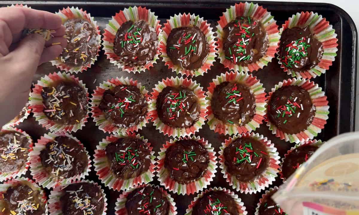 Scattering sprinkles over the holiday pecan toffee bites.