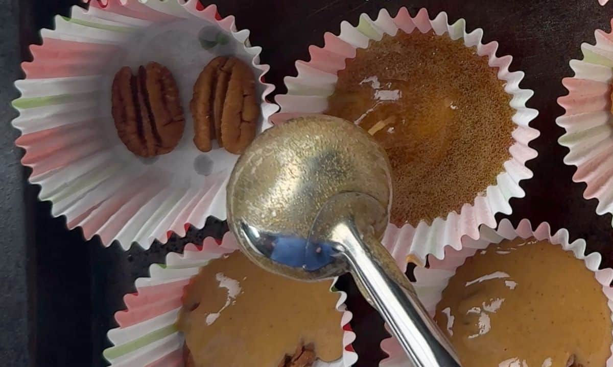 Pouring the melted toffee in a muffin liner.