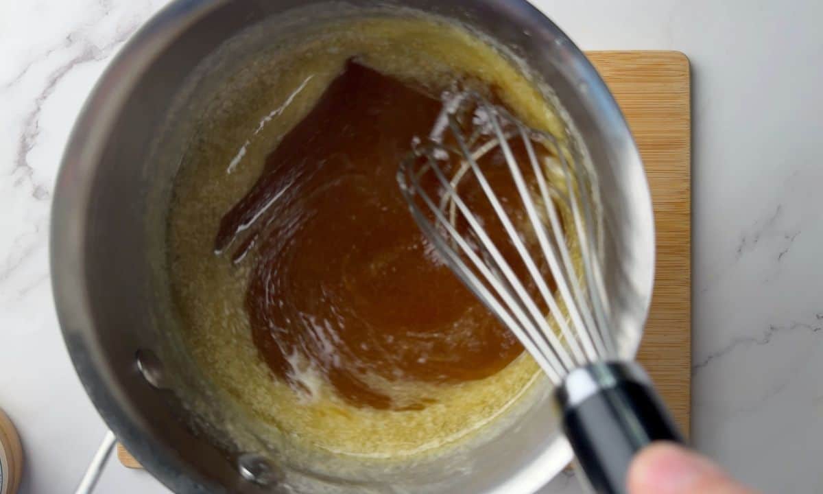 Butter and sweetner whisked in a saucepan.