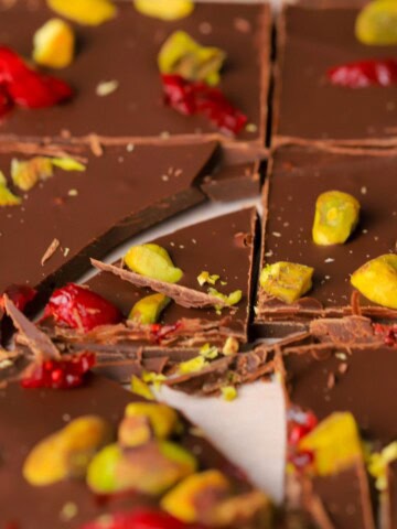 Low carb pistachio cranberry chocolate bark in pieces.