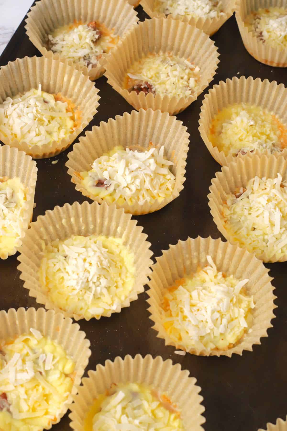 Low carb white chocolate pecan coconut clusters on a sheet pan.