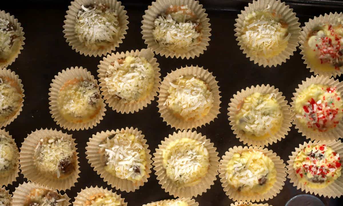 Low carb white chocolate pecan coconut clusters on a sheet pan.