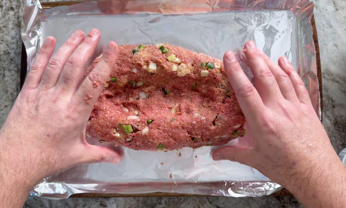 Creating the well in the meatloaf.