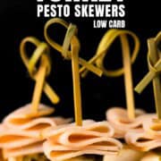 Pinterest pin of the turkey pesto appetizer skewers on a cutting board.
