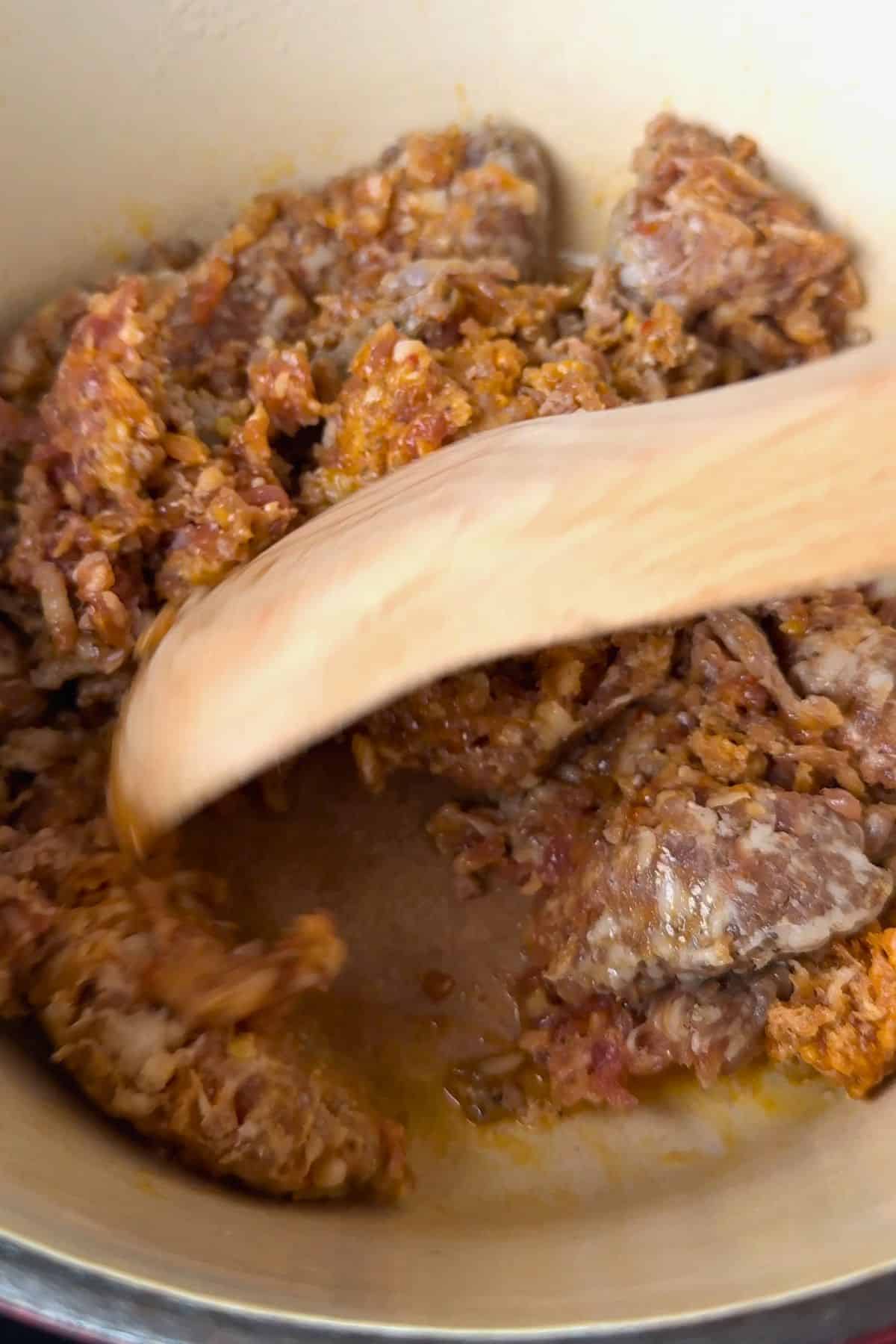 Browning the sausage meat.