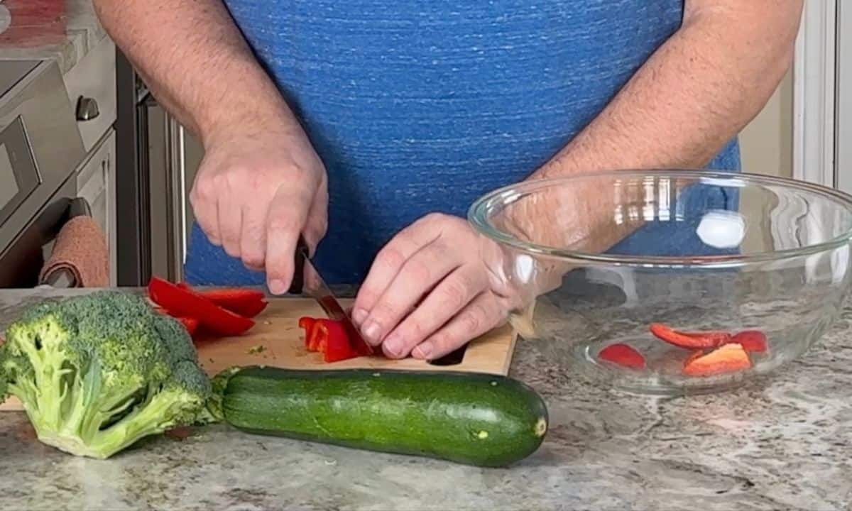 Cutting the vegetables for the lemon garlic chicken.