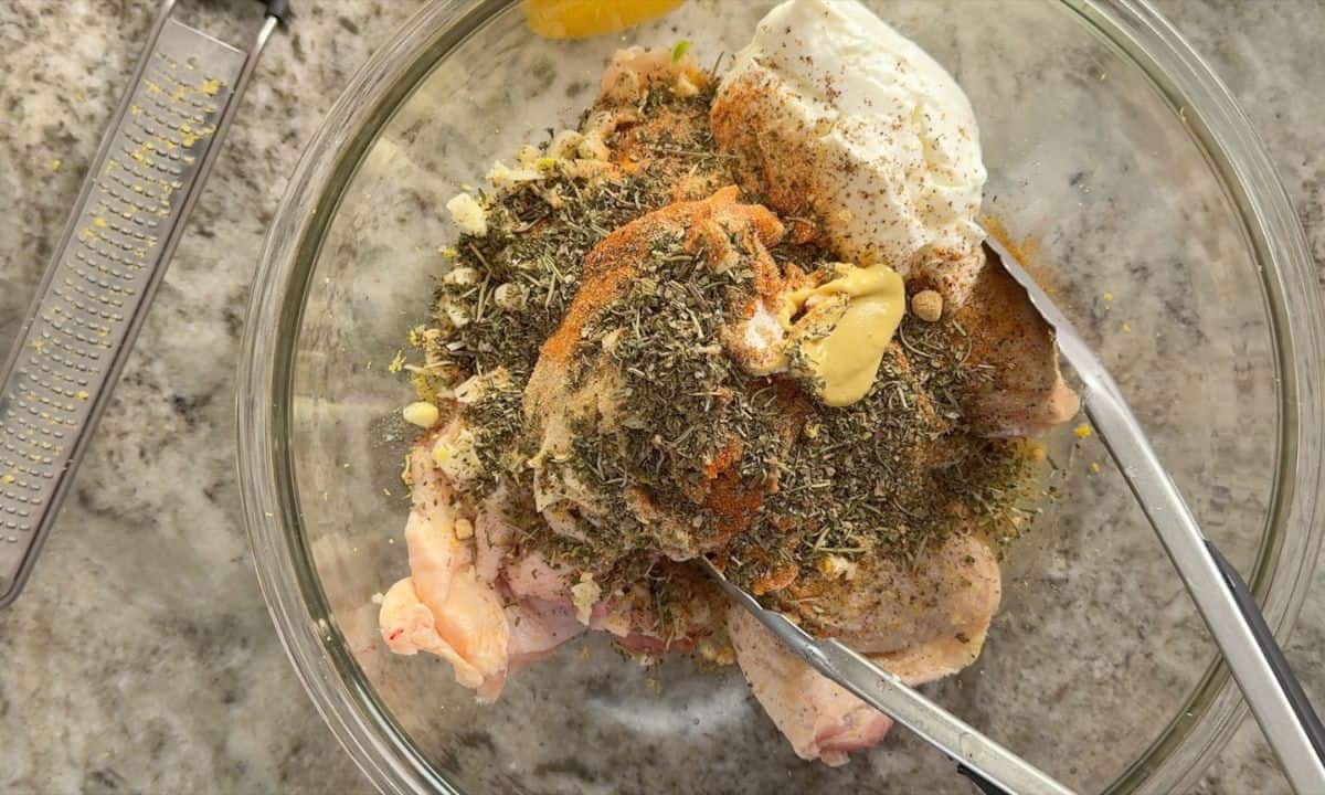 Chicken and ingredients in a bowl.