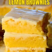 Three low carb lemon brownies stacked on top of each other for a pinterest image.