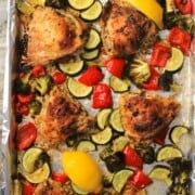 Low carb lemon garlic chicken with vegetables on a sheet pan.