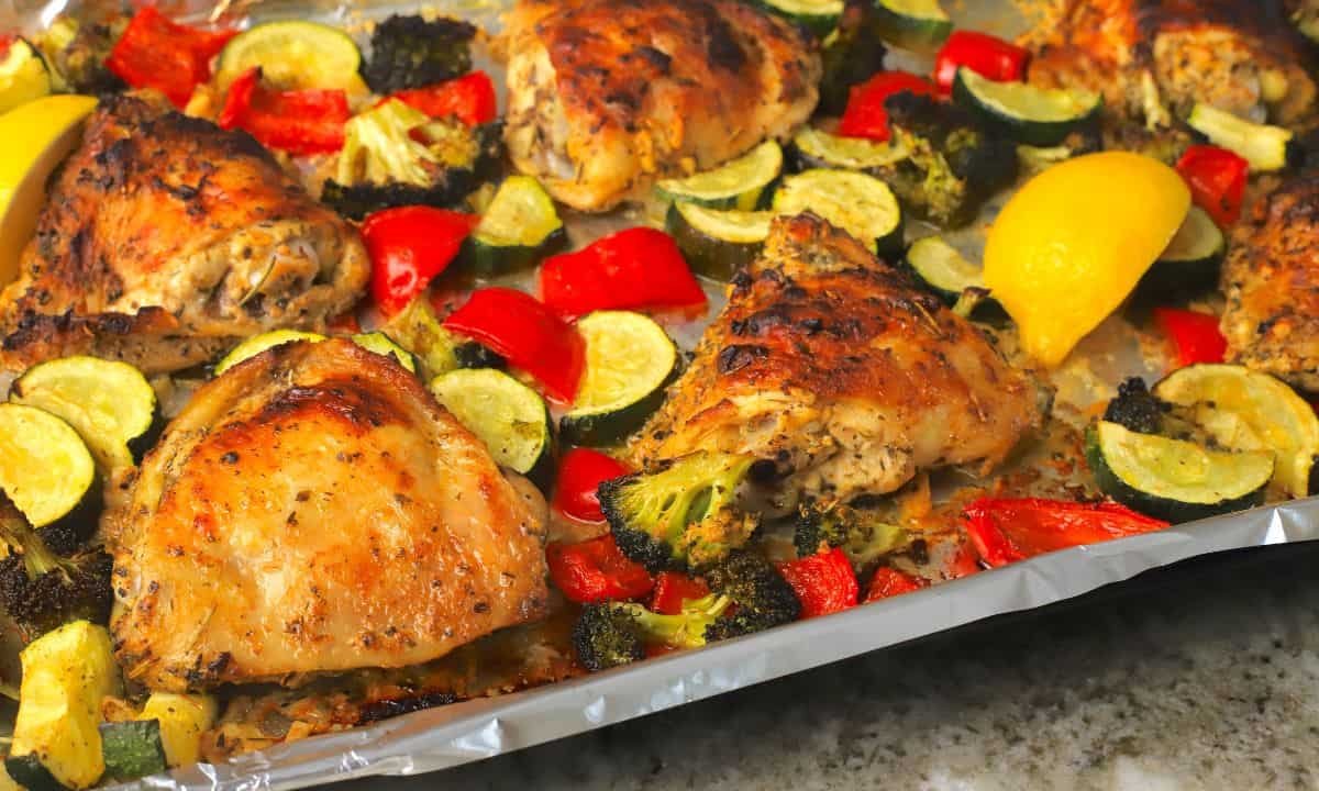 Low carb lemon garlic chicken with vegetables on a sheet pan.