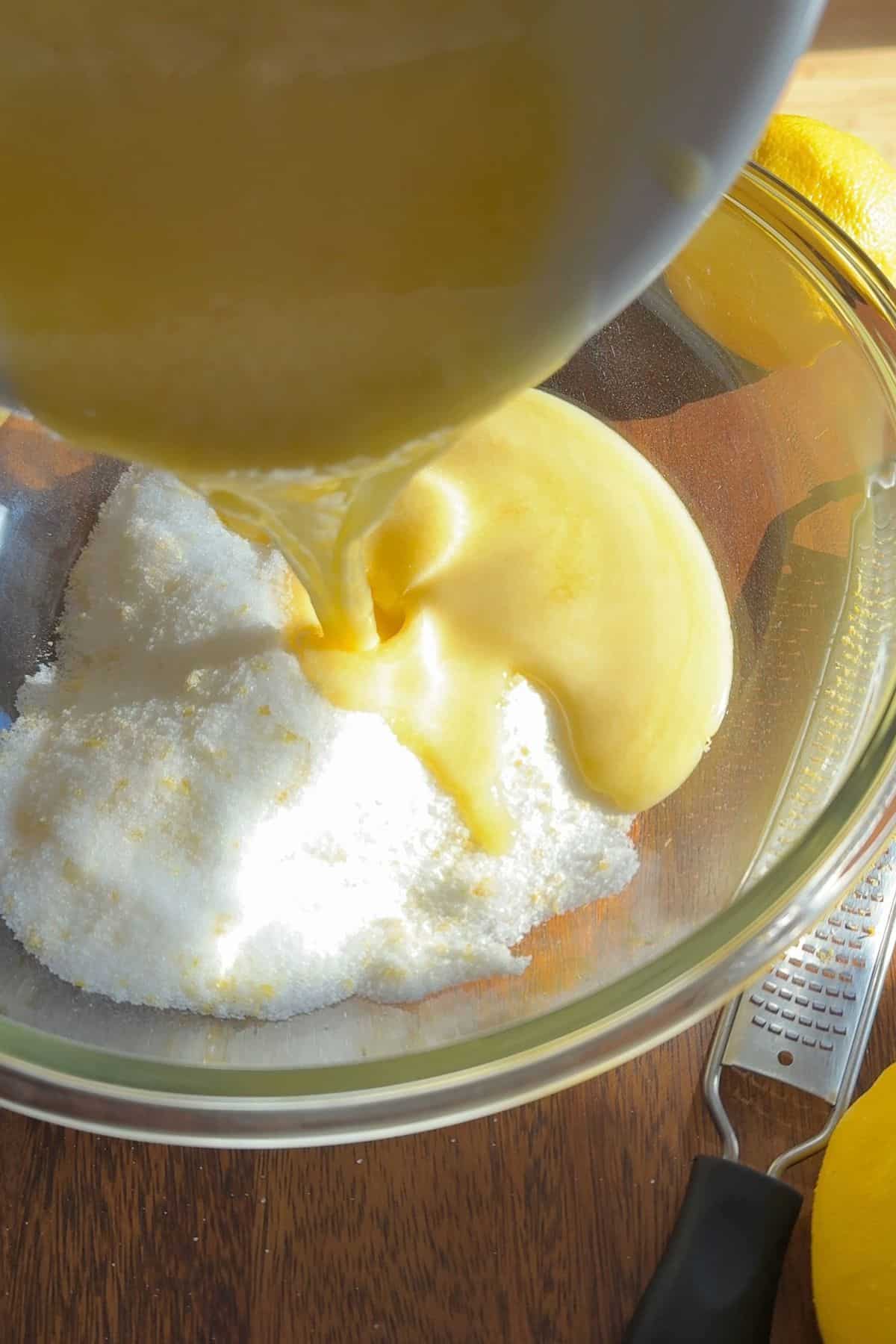 Combining the butter with the sweetener.
