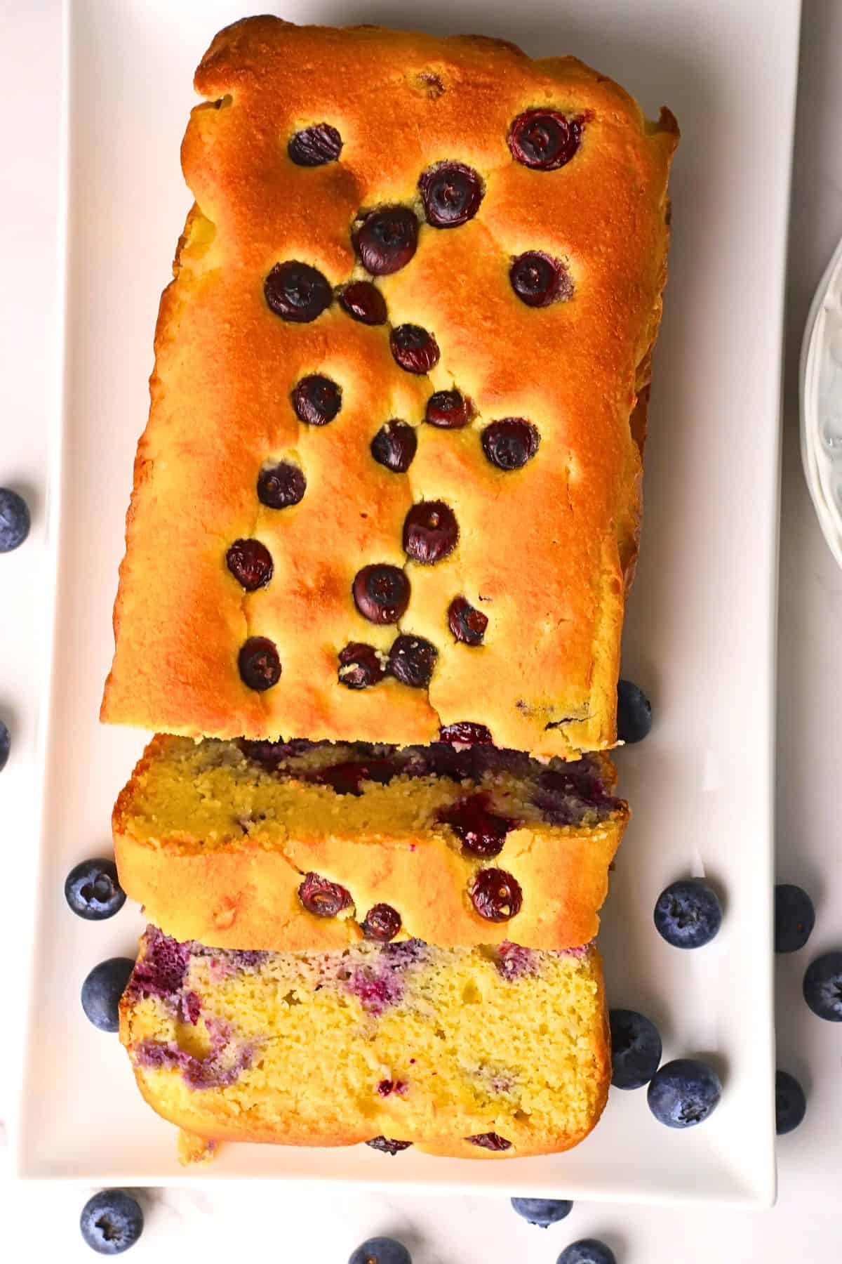 Low carb blueberry cottage cheese loaf cake on a platter.