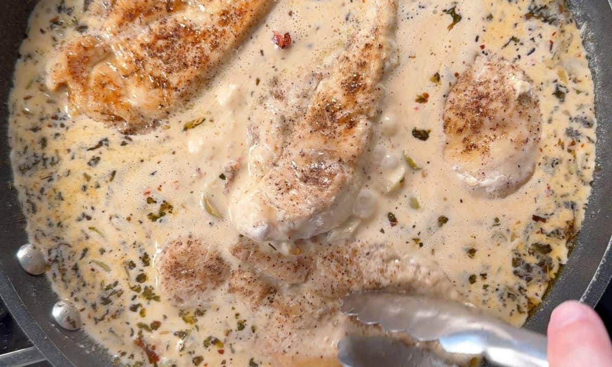 Chicken in sauce in the pan.