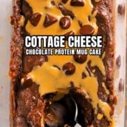 Cottage cheese chocolate protein mug cake drizzled with peanut butter and topped with chocolate chips pinterest image.