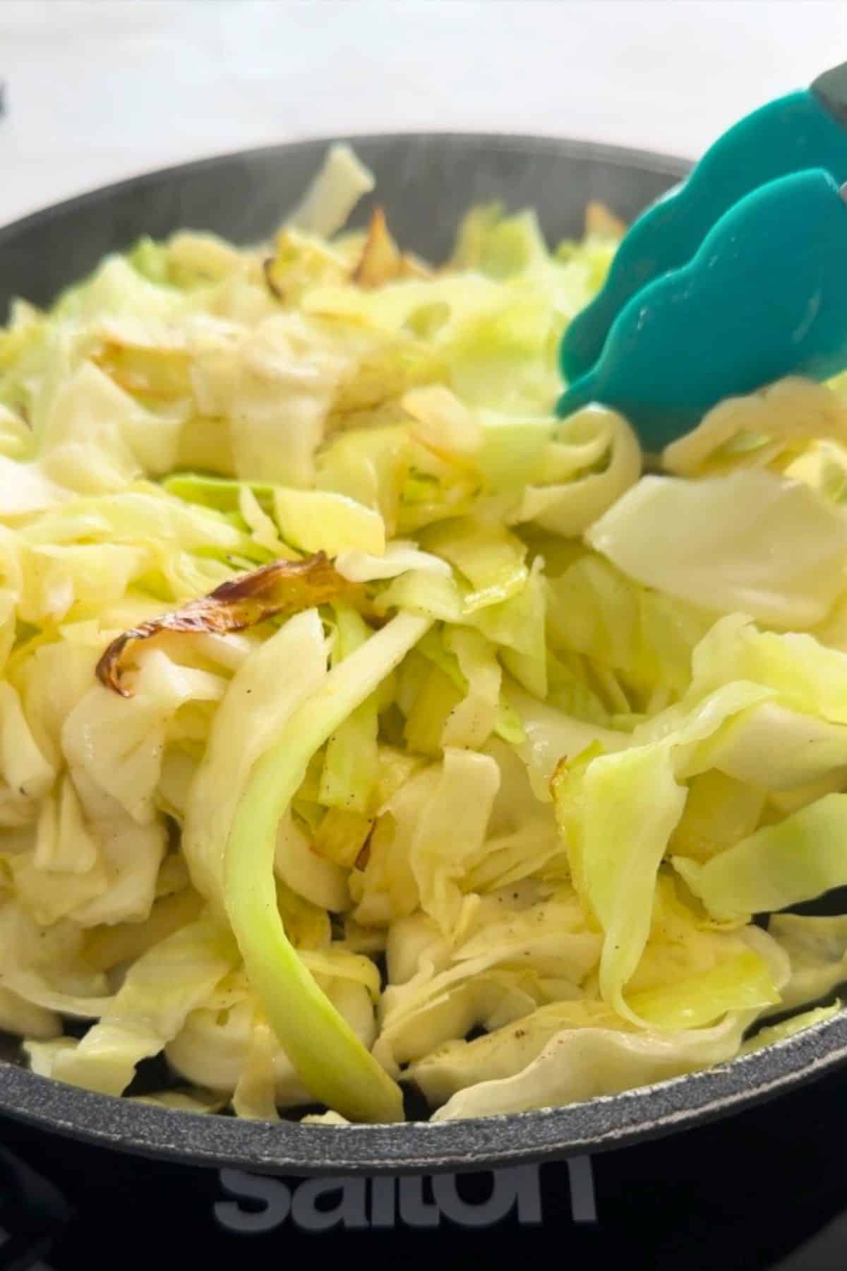 Frying cabbage in the skillet.