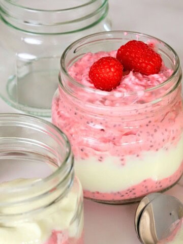 Low carb raspberry chia pudding in a mason jar.