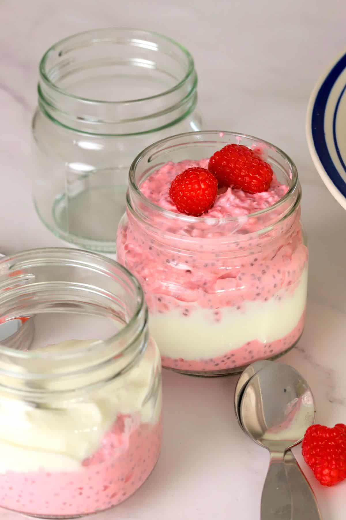 Low carb raspberry chia pudding in a mason jar.