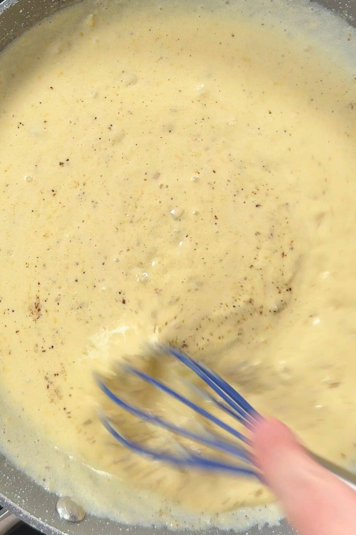 Making the alfredo sauce.