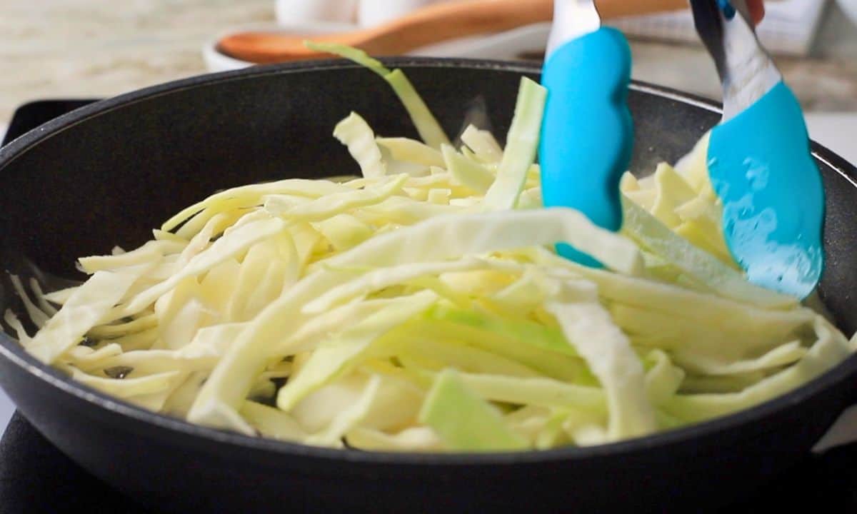 Sliced cabbage in a skillet.