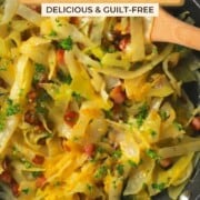 Low carb cabbage carbonara in a pan with a wooden spoon for a pin image.