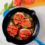 Low carb pesto caprese chicken in a skillet.