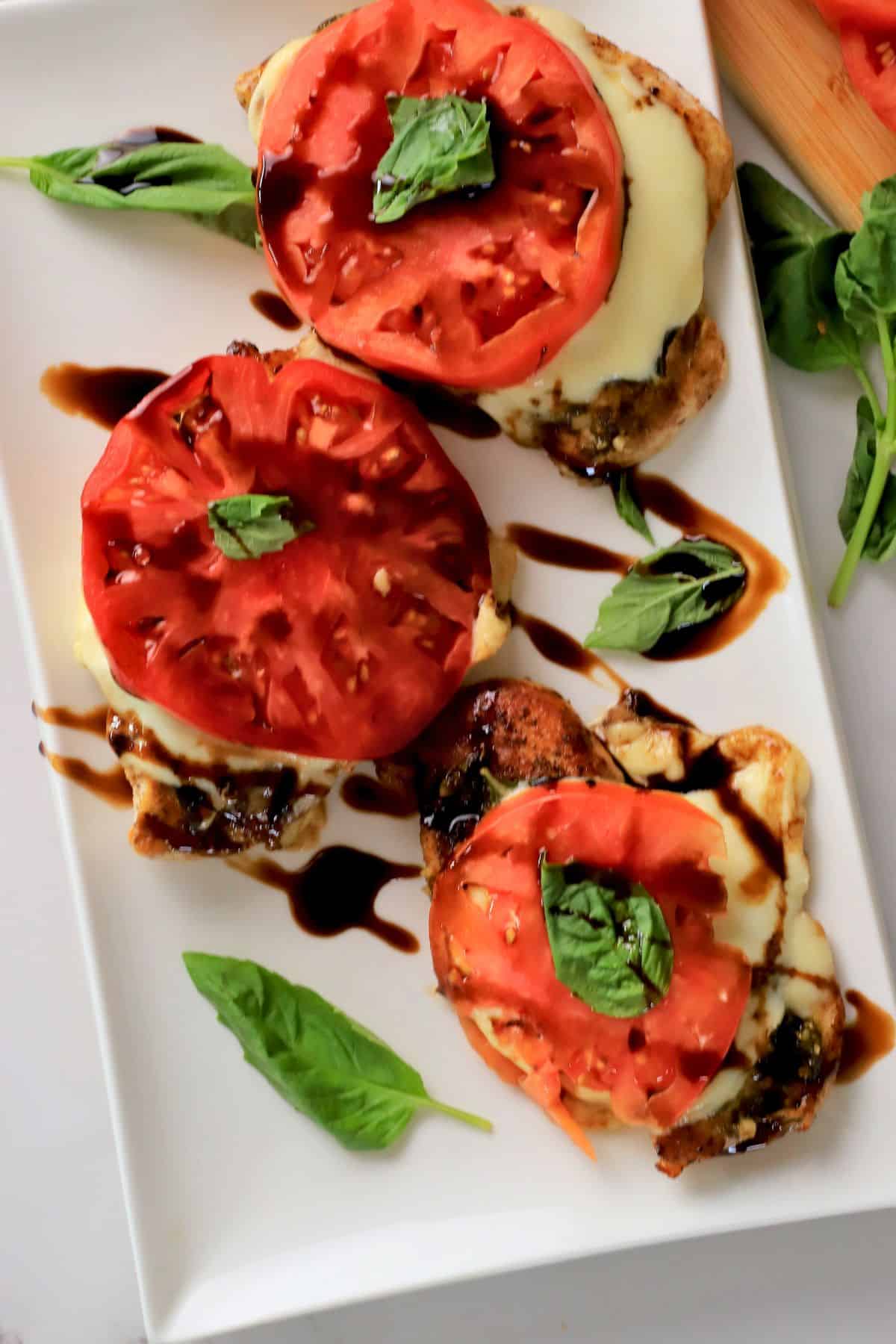 Low carb pesto caprese chicken on a platter.