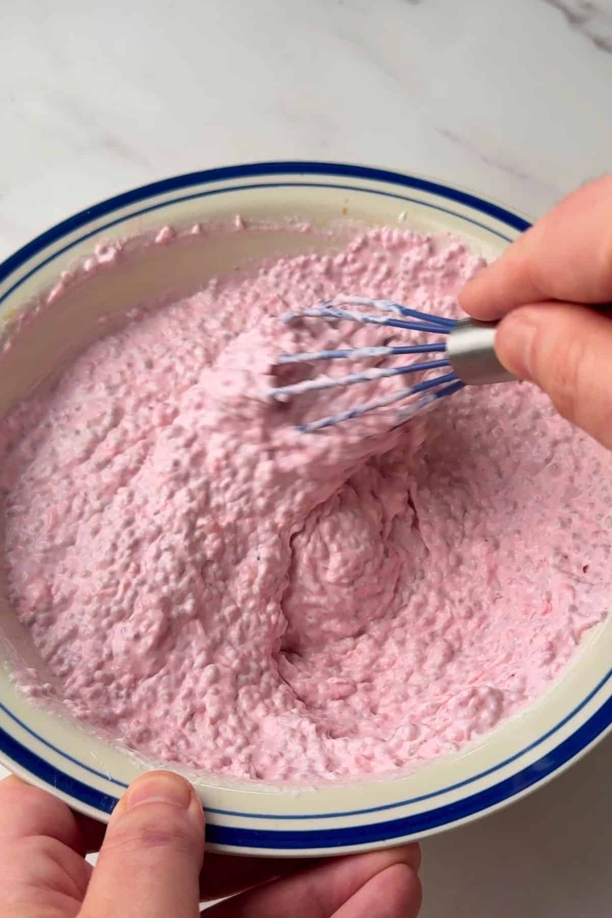 Whisking the chia pudding mixture.