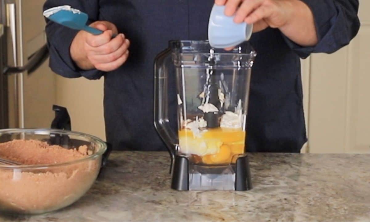 Adding the wet ingredients to the blender.