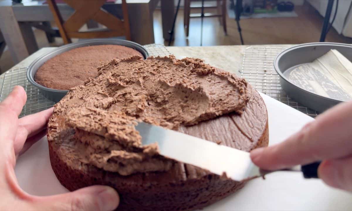 Frosting the chocolate birthday cake.