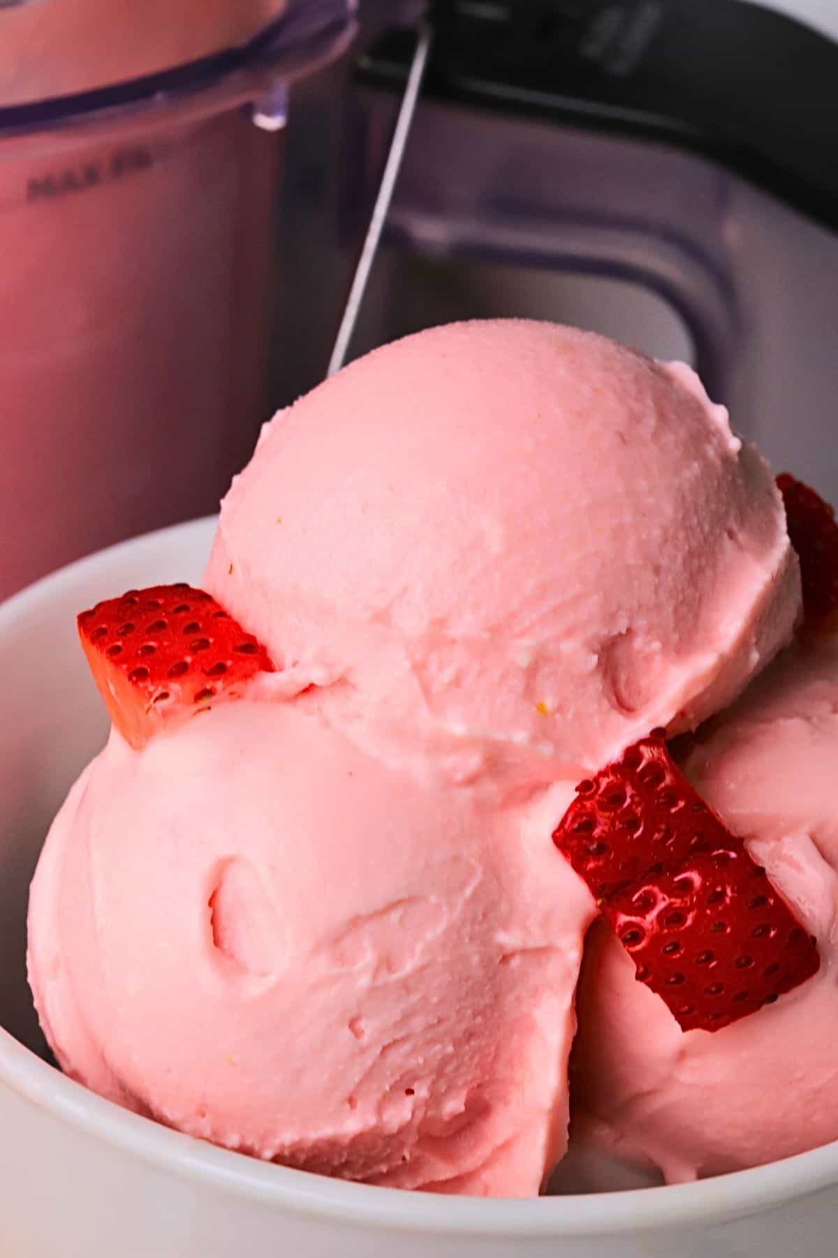 Low carb strawberry cottage cheese ice cream in a bowl.