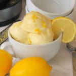 Low carb lemon ice cream in a bowl with a lemon slice.