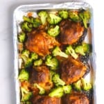 Low carb spicy peanut chicken and broccoli on a sheet pan.