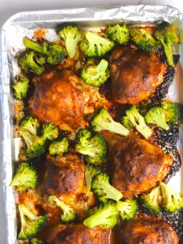 Low carb spicy peanut chicken and broccoli on a sheet pan.