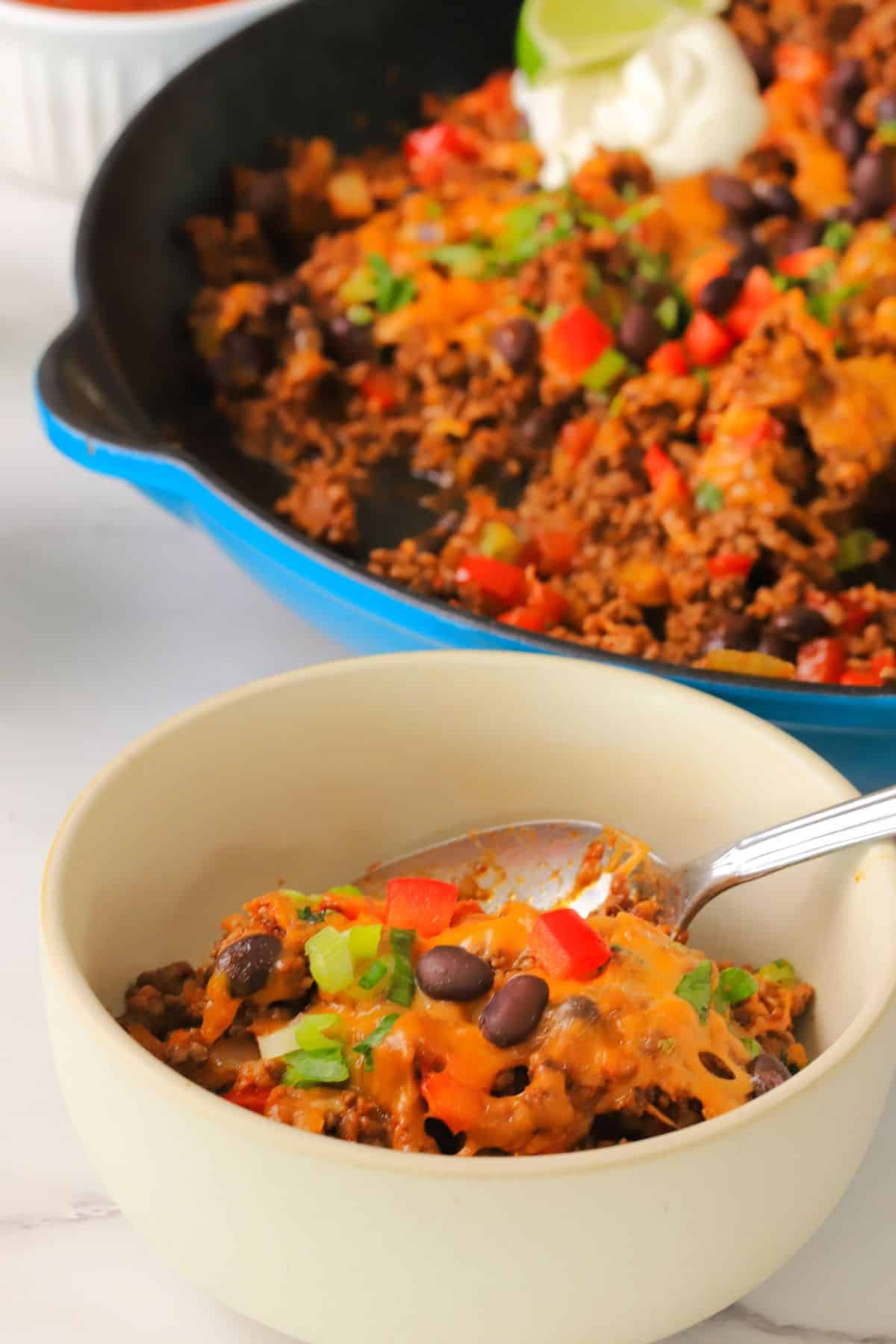 Low carb taco skillet in a bowl next to the skillet.